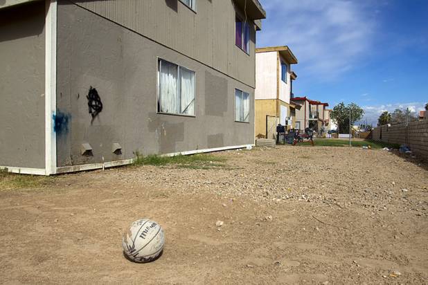 A yard is shown behind an apartment during a County Multi-Agency Response Team (CMART) operation at a neighborhood near Twain Avenue and Decatur Boulevard Wednesday, Oct. 10, 2012. Their efforts follow the "broken windows" theory - if a neighborhood can be kept up, it is less likely to have rampant crime.