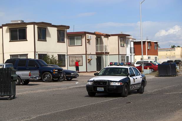 A Metro officer drives through a neighborhood near Twain Avenue and Decatur Boulevard during a County Multi-Agency Response Team (CMART) operation Wednesday, Oct. 10, 2012. Their efforts follow the "broken windows" theory - if a neighborhood can be kept up, it is less likely to have rampant crime.