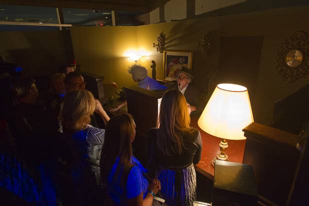 Guests check in at the lobby during a VIP/media night event at the Amazing Jonathan's SCREAMont Experiment haunted hotel at the Las Vegas Club in downtown Las Vegas Thursday, Oct. 10, 2012. The haunted hotel is open nightly from 7 p.m. to midnight.