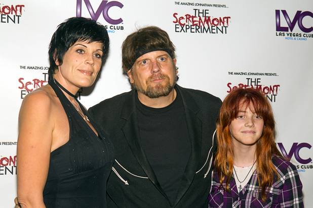 Amazing Jonathan, center, arrives with manager Anastasia Synn and daughter Haley, 12, during a VIP/media night event at his SCREAMont Experiment haunted hotel at the Las Vegas Club in downtown Las Vegas Thursday, Oct. 10, 2012. The haunted hotel is open nightly from 7 p.m. to midnight.