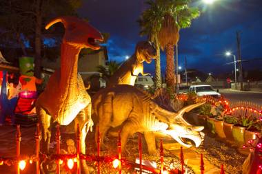 A view of Steve Springer’s prehistoric front yard that was decorated in October in a Halloween theme.