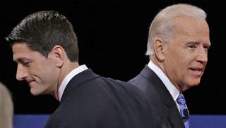 Republican vice presidential nominee Rep. Paul Ryan of Wisconsin and Vice President Joe Biden pass each other after the vice presidential debate at Centre College, Thursday, Oct. 11, 2012, in Danville, Ky.