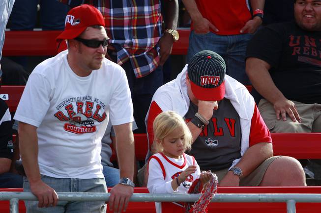 UNLV fans react to UNR's go-ahead touchdown during their game ...