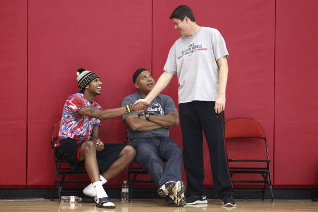 Jelan Kendrick shakes hands with UNLV basketball coach Dave Rice while on an official visit and taking in the Rebels first practice of the season with his dad Lonnie Kendrick Friday, Oct. 12, 2012. Kendrick committed to UNLV on Saturday.