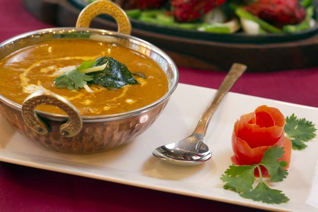 Chicken Madras curry served with white rice at Saffron Flavors of India restaurant, 4450 N. Tenaya Way, Sunday, Oct. 14, 2012. The garnish is cilantro with a tomato skin shaped into a flower.