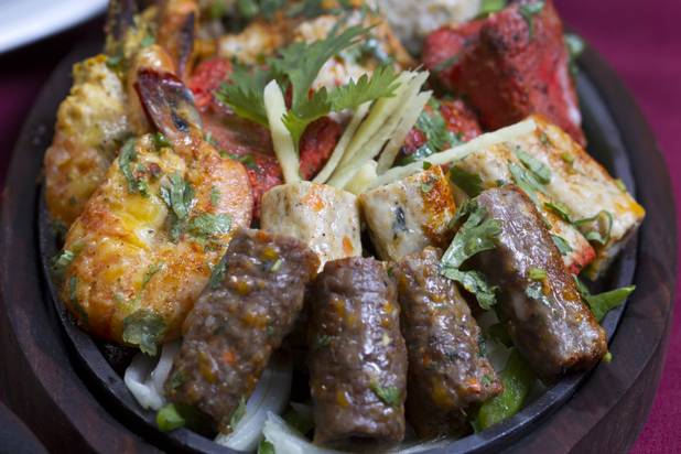A mixed platter of seekh kebob, reshmi kebob, tandoori shrimp, chicken tikka and murgh malai chicken at Saffron Flavors of India.