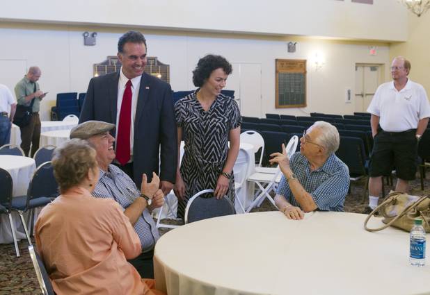 Danny Tarkanian, candidate for the state's 4th Congressional District, and his wife Amy arrive for a debate with Steven Horsford at Temple Sinai of Las Vegas in Summerlin Sunday, Oct. 14, 2012. The temple's Men's Club sponsored the debate.