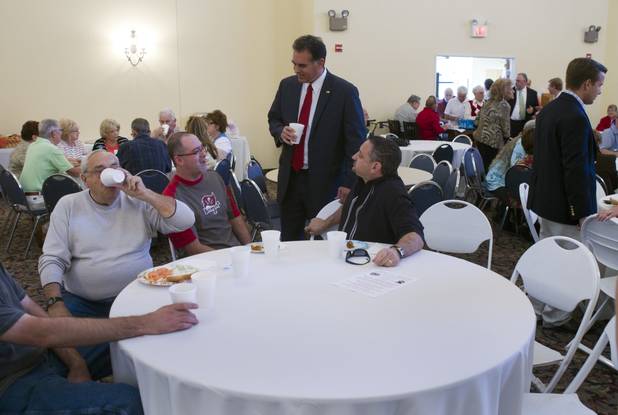 Danny Tarkanian, candidate for the state's 4th Congressional District, visits with a group at a table before a debate with Steven Horsford at Temple Sinai of Las Vegas in Summerlin Sunday, Oct. 14, 2012. The temple's Men's Club sponsored the debate.
