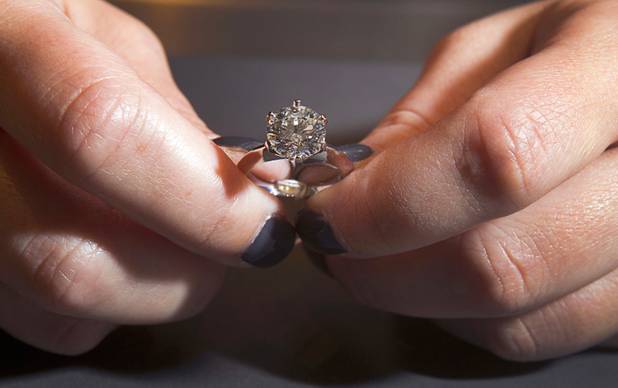 An engagement ring is displayed at Tiffany and Co. in the Crystals retail mall Monday, Oct. 15, 2012. The ring, with a 3.45 carat, D color, internally flawless diamond, retails for $488,500.00.