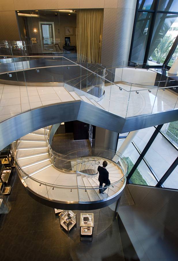 A man goes down a spiral staircase to the first floor of the Tiffany and Co. in the Crystals retail mall Monday, Oct. 15, 2012.