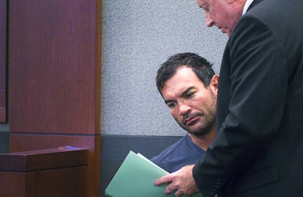 George Tiaffay confers with attorney Robert Langford in court at the Clark County Regional Justice Center Monday, Oct. 15, 2012. Tiaffay, a City of Las Vegas firefighter, allegedly paid Noel Stevens, a homeless man, to kill his estranged wife, then tried to commit suicide when suspicion turned toward him.