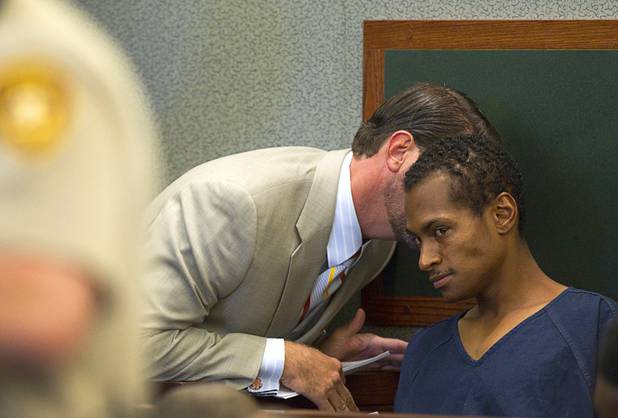 Noel Stevens listens to attorney Curtis Brown at the Clark County Regional Justice Center Monday, Oct. 15, 2012. George Tiaffay, a City of Las Vegas firefighter, allegedly paid Stevens, a homeless man, to kill his estranged wife, then tried to commit suicide when suspicion turned toward him.