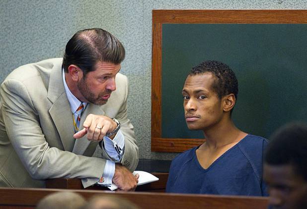 Noel Stevens listens to attorney Curtis Brown at the Clark County Regional Justice Center Monday, Oct. 15, 2012. George Tiaffay, a City of Las Vegas firefighter, allegedly paid Stevens, a homeless man, to kill his estranged wife, then tried to commit suicide when suspicion turned toward him.