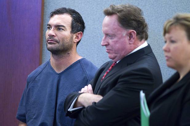 George Tiaffay, left, stands with attorneys Robert Langford and Maggie McLetchie during an initial appearance in court at the Clark County Regional Justice Center Monday, Oct. 15, 2012. Tiaffay, a City of Las Vegas firefighter, allegedly paid Noel Stevens, a homeless man, to kill his estranged wife, then tried to commit suicide when suspicion turned toward him.