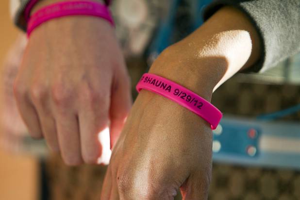 Friends of Shauna Tiaffay wear custom bracelets in her memory at the Clark County Regional Justice Center Monday, Oct. 15, 2012. George Tiaffay, a City of Las Vegas firefighter, allegedly paid Noel Stevens, a homeless man, to kill his estranged wife Shauna Tiaffay, then tried to commit suicide when suspicion turned toward him.