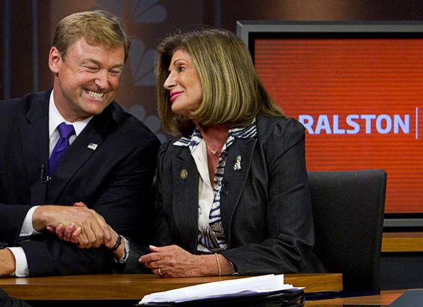 Dean Heller and Shelley Berkley, candidates for Nevada's U.S. Senate seat, shake hands after a debate on the "Ralston Reports" television program at the KSNV-Channel 3 studios Monday, Oct. 15, 2012.