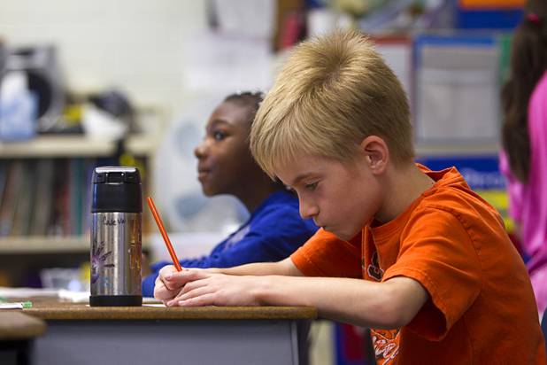 Third grader Cade Vail works on an assignment at Lomie Heard Elementary School on Nellis Air Force Base Tuesday, Oct. 16, 2012. The school is the only Clark County school on a military base.