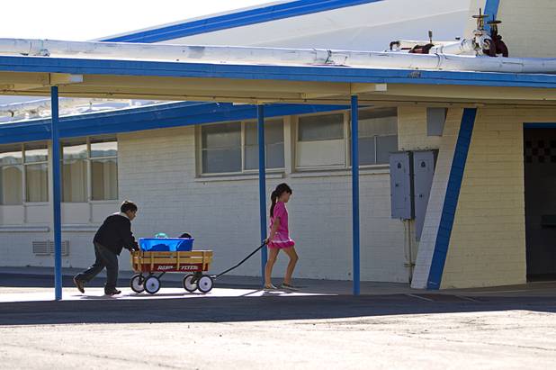 Students use a wagon to lunches the cafeteria at Lomie Heard Elementary School on Nellis Air Force Base Tuesday, Oct. 16, 2012. The school is the only Clark County school on a military base.