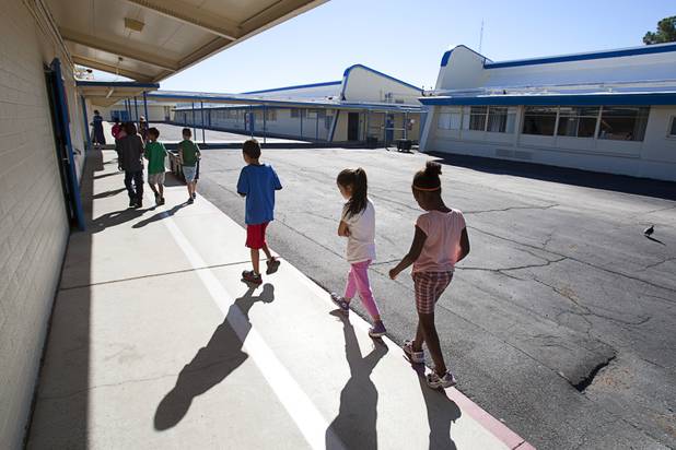 Students walk through Lomie Heard Elementary School on Nellis Air Force Base Tuesday, Oct. 16, 2012. The school is the only Clark County school on a military base.