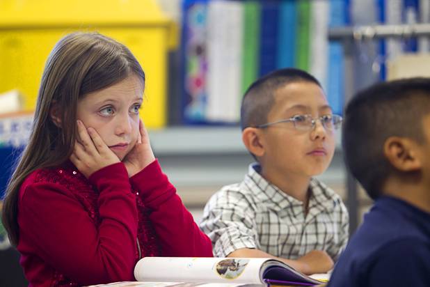 Third grader McKenna McGough, left, listens during class at Lomie Heard Elementary School on Nellis Air Force Base Tuesday, Oct. 16, 2012. The school is the only Clark County school on a military base.