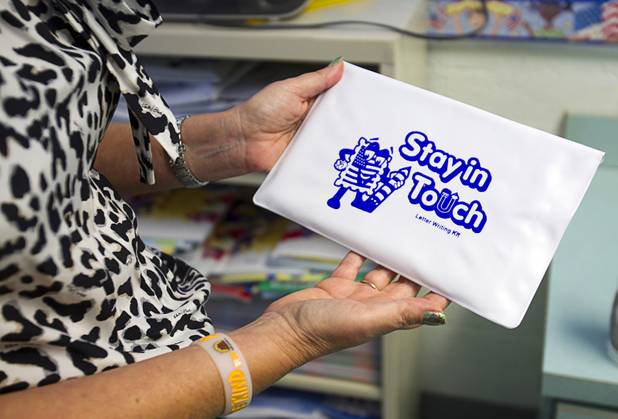 Counselor Terry Ann Coletto holds a letter writing kit at Lomie Heard Elementary School on Nellis Air Force Base Tuesday, Oct. 16, 2012. The school is the only Clark County school on a military base. The base supplies the the letter writing kits, she said.