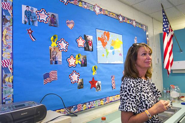 Counselor Terry Ann Coletto stands by a deployment wall  at Lomie Heard Elementary School on Nellis Air Force Base Tuesday, Oct. 16, 2012. The school is the only Clark County school on a military base.