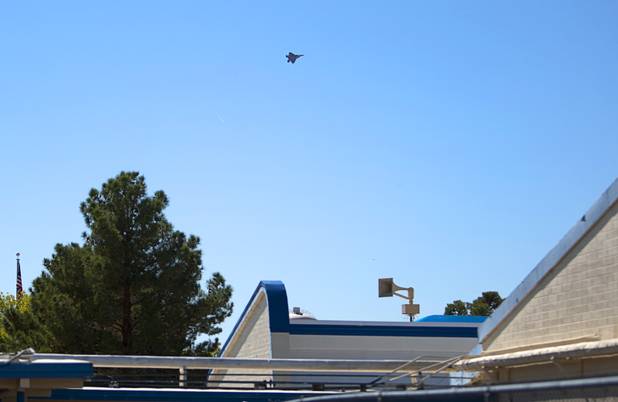 A fighter jet flies by Lomie Heard Elementary School on Nellis Air Force Base Tuesday, Oct. 16, 2012. The school is the only Clark County school on a military base.