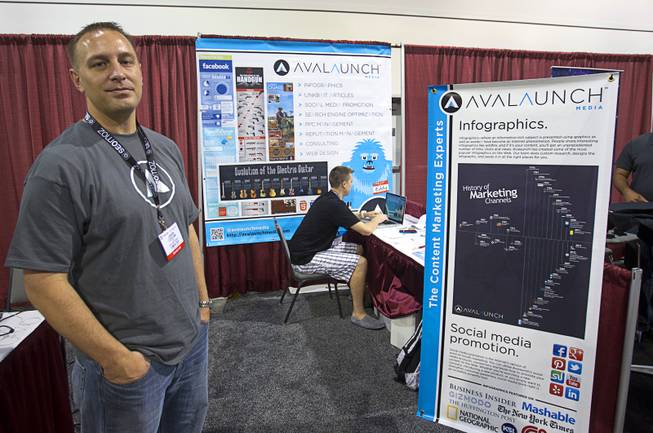Jason Coulam, COO of Avalaunch Media, mans a booth during PubCon, a social media and optimization conference, at the Las Vegas Convention Center Wednesday, Oct. 17, 2012.