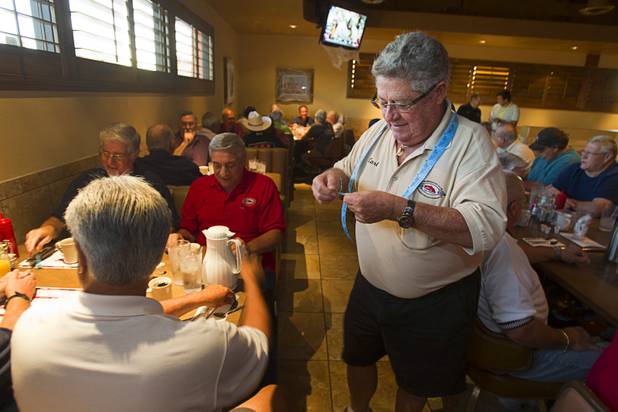 Carl Cala holds out raffle tickets during a Breakfast Club of Automotive Enthusiasts weekly meeting at the T-Bird Restaurant and Lounge, 9465 South Eastern Avenue, Wednesday, Oct. 17, 2012. The winner of the raffle gets a free breakfast at the next meeting.