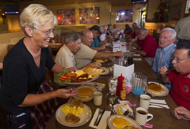 Waitress Joanie Johnson serves up breakfast orders during a Breakfast Club of Automotive Enthusiasts weekly meeting at the T-Bird Restaurant and Lounge, 9465 South Eastern Avenue, Wednesday, Oct. 17, 2012.