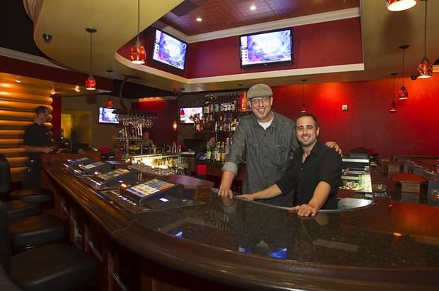 General manager Lief Marwede and bartender Michael Przydzial pose in the Players Club, a bar at Stephanie Street and Paseo Verde Parkway, in Henderson Thursday, Oct. 18, 2012.