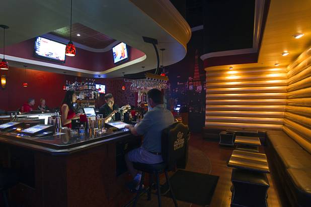 Bartender Michael Przydzial makes a cocktail in the Players Club, a bar at Stephanie Street and Paseo Verde Parkway, in Henderson Thursday, Oct. 18, 2012.