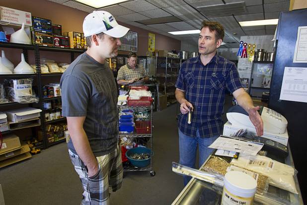 Owner Steve Berg, right, gives brewing advice to Brandon DeVere at Vegas Homebrew & Winemaking, 5140 W. Charleston Blvd., Thursday, Oct. 18, 2012.