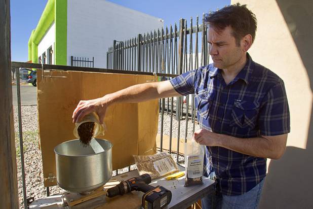 Owner Steve Berg pours barley into a mill outside Vegas Homebrew & Winemaking, 5140 W. Charleston Blvd., Thursday, Oct. 18, 2012.