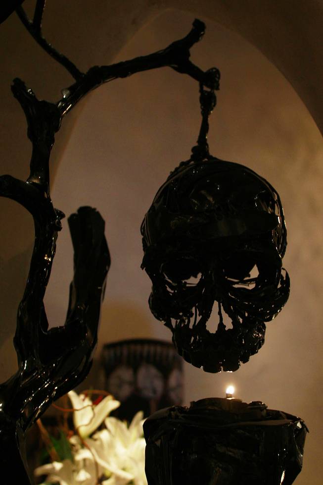A skull hangs over a candle at Javier's in Aria Oct. 18, 2012.