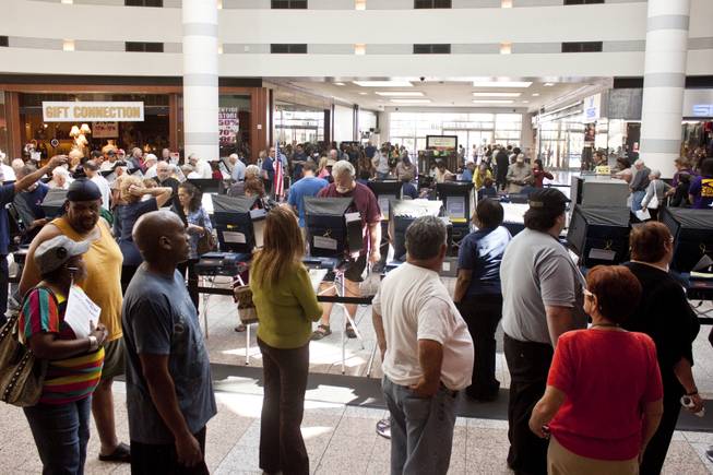 Voters wait in line on the first day of early voting at Boulevard Mall, Saturday, Oct. 20, 2012.