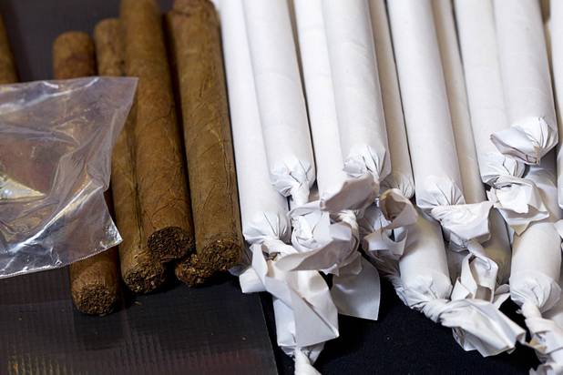 Cigar bunches are ready to be wrapped during a private party in the Foundation Room at the Mandalay Bay Sunday, Oct. 21, 2012. The paper keeps the tobacco leaf together before it is wrapped. Cigar Dolls is a company that provides attractive cigar rollers for corporate events or private parties.