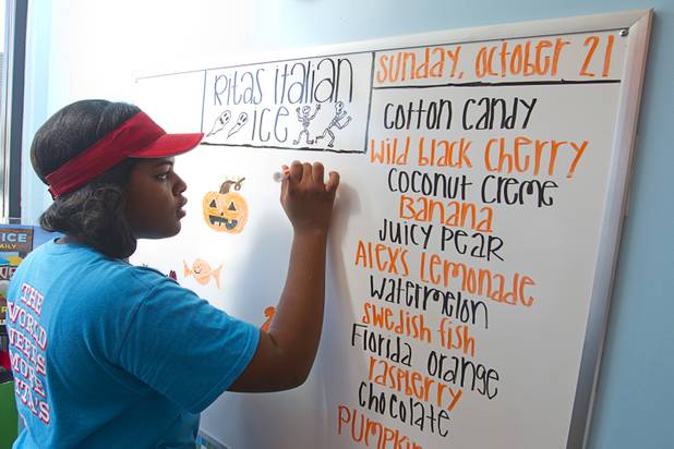 Erica Sloan, a certified Italian ice maker, decorates the daily menu at Rita's Green Valley, a custard and Italian ice shop in Henderson, Sunday, Oct. 21, 2012. Rita's, on Stephanie Street just north of Sunset Road, is the first Nevada franchise of a popular East Coast chain that originated in Bensalem Township, Penn.