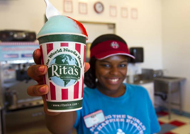 Erica Sloan, a certified Italian ice maker, holds a cup of Italian ice at Rita's Green Valley, a custard and Italian ice shop in Henderson, Sunday, Oct. 21, 2012. Rita's, on Stephanie Street just north of Sunset Road, is the first Nevada franchise of a popular East Coast chain that originated in Bensalem Township, Penn.