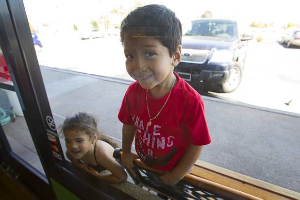Nevaeh Johnson and Alan Arias, both four-years-old, wait for Italian ice outside Rita's Green Valley, a custard and Italian ice shop in Henderson, Sunday, Oct. 21, 2012. Rita's, on Stephanie Street just north of Sunset Road, is the first Nevada franchise of a popular East Coast chain that originated in Bensalem Township, Penn.