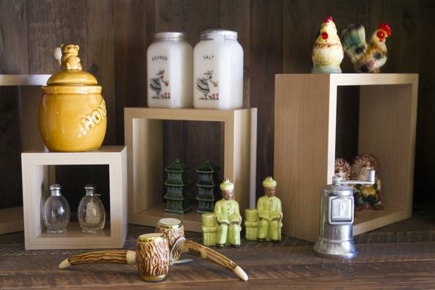 A collection of salt and pepper shakers is displayed at Honey Salt, a new restaurant at 1031 S Rampart Blvd, Monday, Oct. 22, 2012.