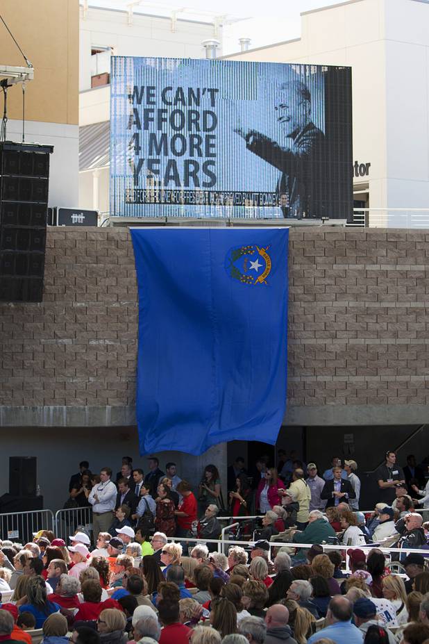 An advertisement for Republican presidential candidate Mitt Romney features the image of President Barack Obama during a campaign rally at the Henderson Pavilion Tuesday, Oct. 23, 2012.