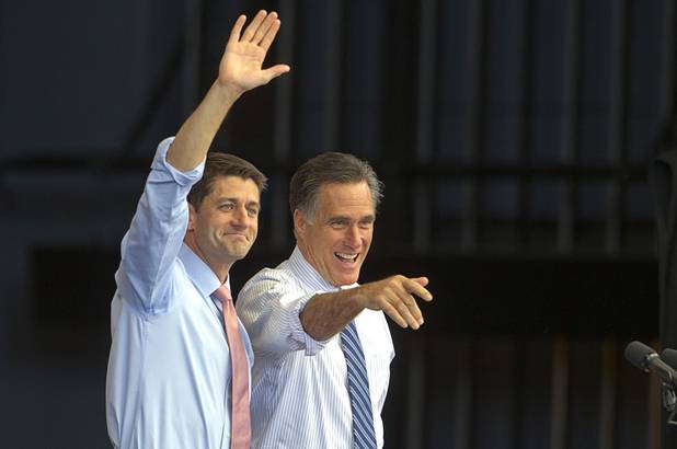 Republican vice presidential candidate Paul Ryan, left, and presidential candidate Mitt Romney wave during a campaign rally at the Henderson Pavilion Tuesday, Oct. 23, 2012.