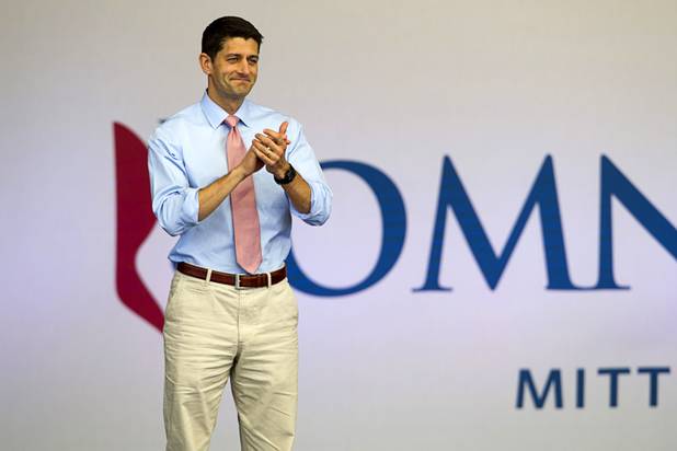 Republican vice presidential candidate Paul Ryan applauds presidential candidate Mitt Romney during a campaign rally at the Henderson Pavilion Tuesday, Oct. 23, 2012.