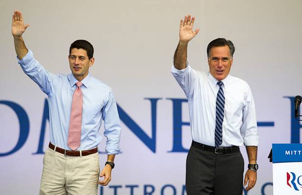 Republican presidential candidate Mitt Romney, right, and running mate Paul Ryan wave at the conclusion of a campaign rally at the Henderson Pavilion Tuesday, Oct. 23, 2012.