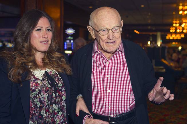 Las Vegas gaming pioneer Jackie Gaughan arrives with Alexandra Epstein, executive vice president of the El Cortez, as he celebrates his 92nd birthday with a champagne and cake celebration at the El Cortez in downtown Las Vegas, Wednesday, Oct. 24, 2012.
