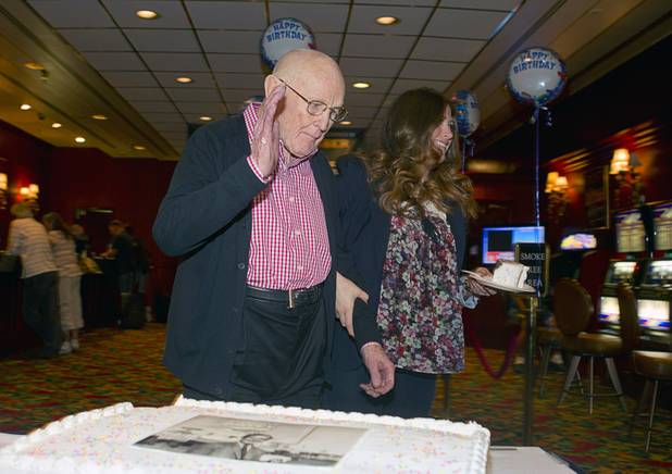 Las Vegas gaming pioneer Jackie Gaughan waves as he leaves a champagne and cake celebration to play poker on his 92nd birthday at the El Cortez in downtown Las Vegas, Wednesday, Oct. 24, 2012.