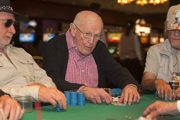 Las Vegas gaming pioneer Jackie Gaughan, center, plays poker on his 92nd birthday at the El Cortez in downtown Las Vegas, Wednesday, Oct. 24, 2012.
