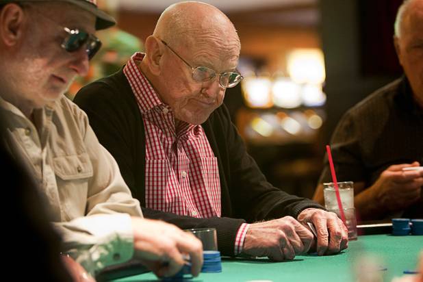 Las Vegas gaming pioneer Jackie Gaughan, center, plays poker on his 92nd birthday at the El Cortez in downtown Las Vegas, Wednesday, Oct. 24, 2012.