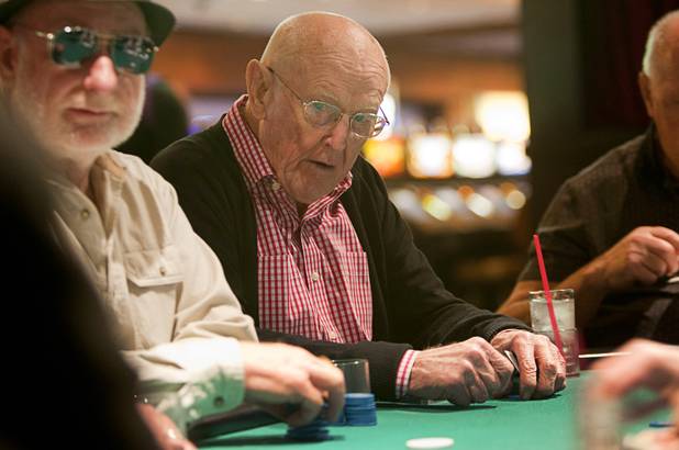 Las Vegas gaming pioneer Jackie Gaughan, center, plays poker on his 92nd birthday at the El Cortez in downtown Las Vegas, Wednesday, Oct. 24, 2012.